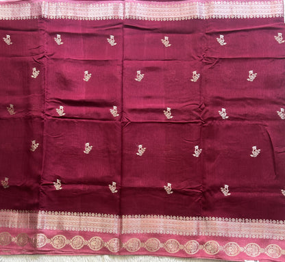Banarasi Fancy Saree Violet Colored Complemented with a Silver Zari Border.