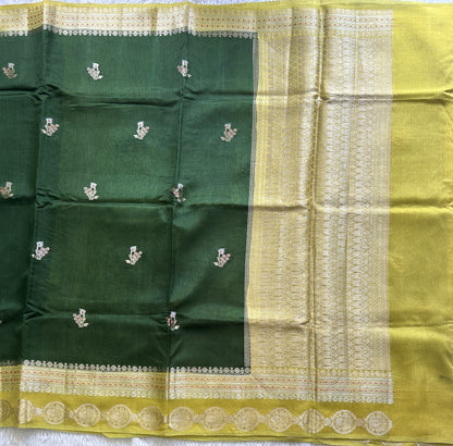 Banarasi Fancy Saree Jungle Green Colored Complemented with a Gold Zari Border.