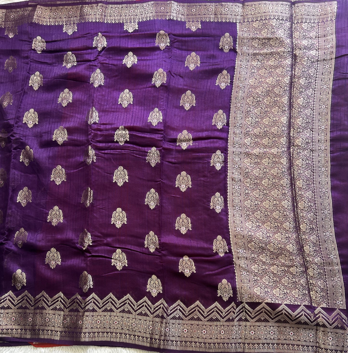 Banarasi Fancy Saree Russian Colored Complemented with a Silver Zari Border.