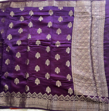 Banarasi Fancy Saree Russian Colored Complemented with a Silver Zari Border.