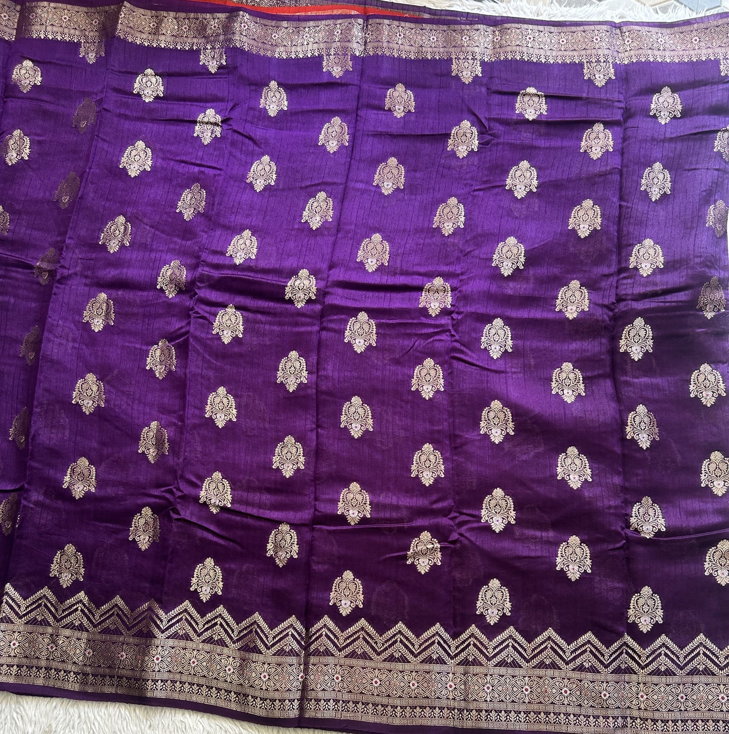 Banarasi Fancy Saree Russian Colored Complemented with a Silver Zari Border.