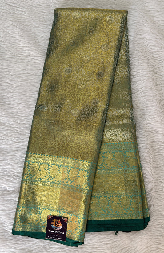 Kanjivaram Bridal Silk Saree Pastel Green colored Saree complemented with a Rama Green Colored Kanchi border. - Sampradaya Designer Studio