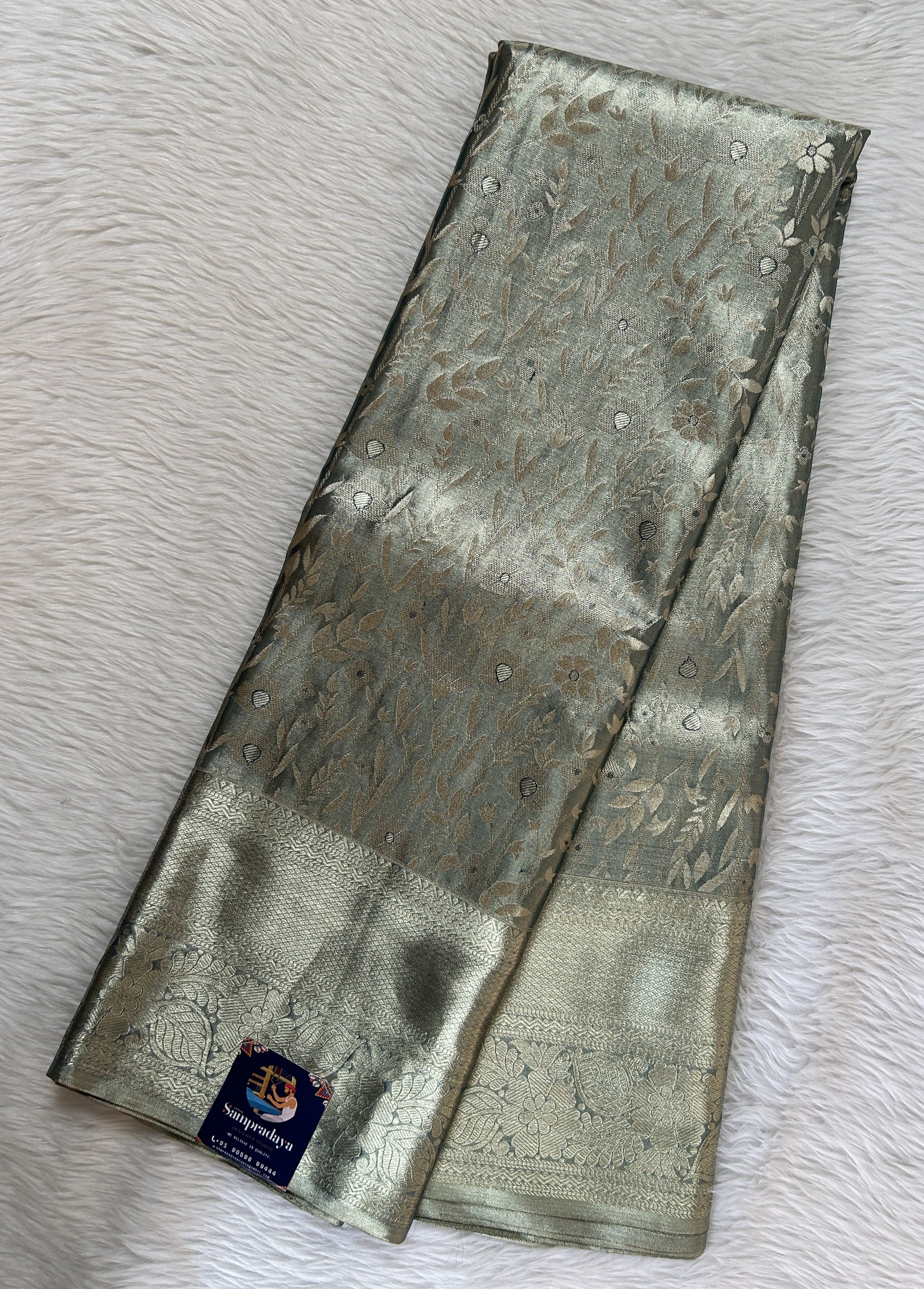Kanjivaram Bridal Silk Saree Tea Green colored Saree complemented with a Gold Kanchi border. - Sampradaya Designer Studio
