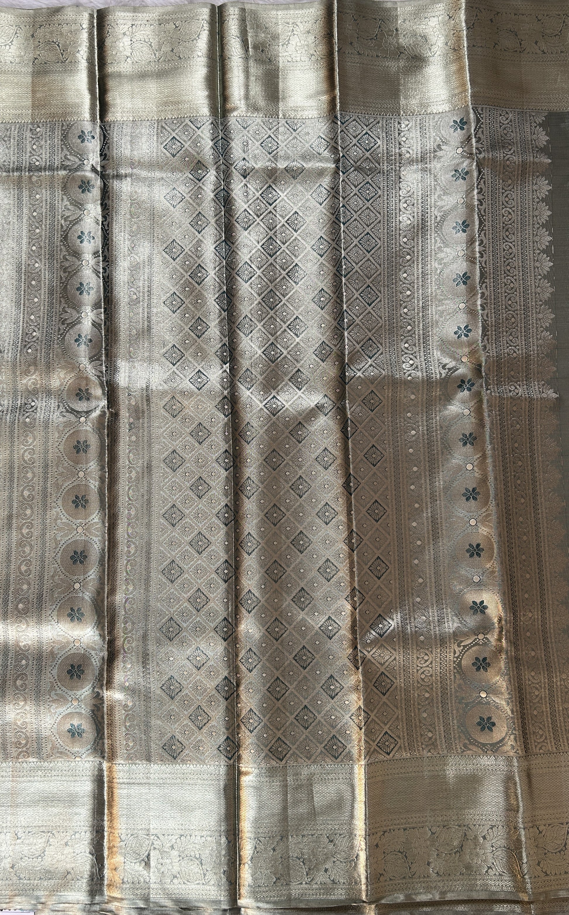 Kanjivaram Bridal Silk Saree Tea Green colored Saree complemented with a Gold Kanchi border. - Sampradaya Designer Studio