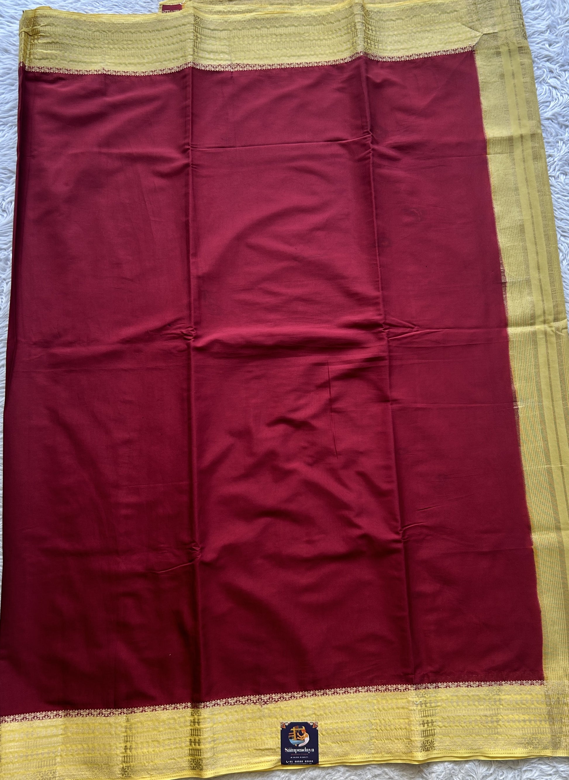 Semi Georgette Saree Maroon Colored Complemented with a Light Yellow Color Zari Border. - Sampradaya Designer Studio