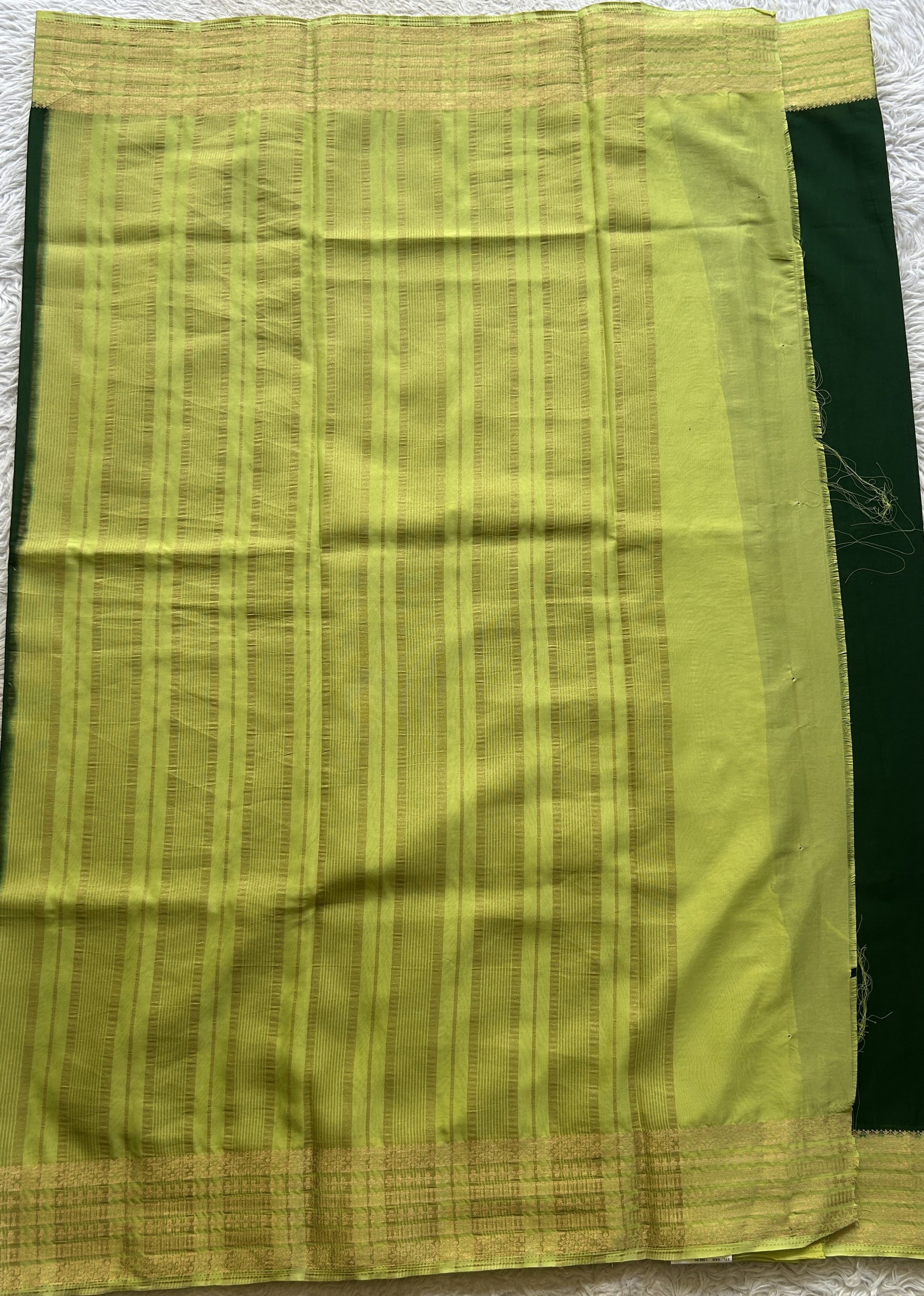 Semi Georgette Saree Dark Green Colored Complemented with a Lemon Green Color Zari Border. - Sampradaya Designer Studio