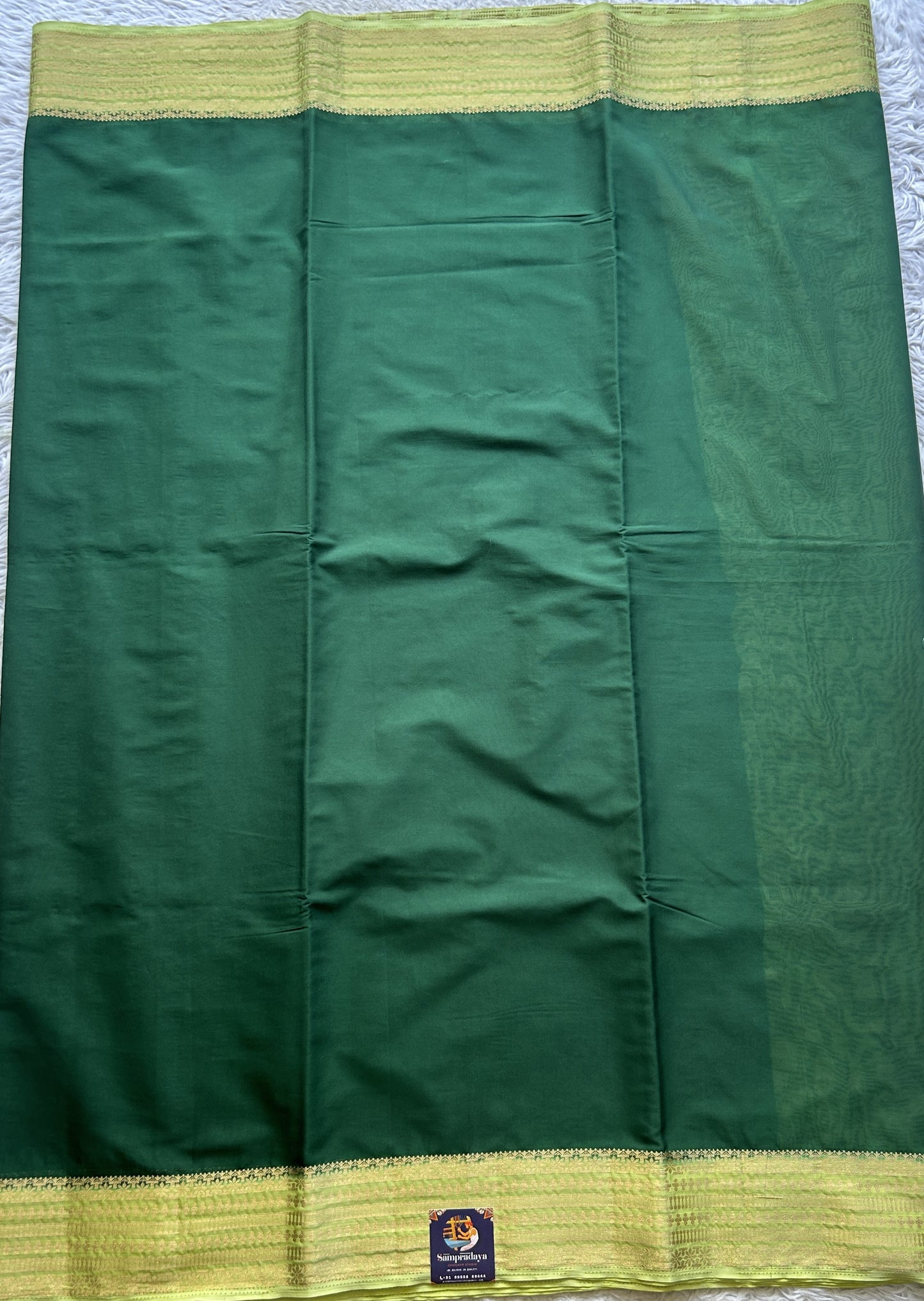 Semi Georgette Saree Dark Green Colored Complemented with a Lemon Green Color Zari Border. - Sampradaya Designer Studio