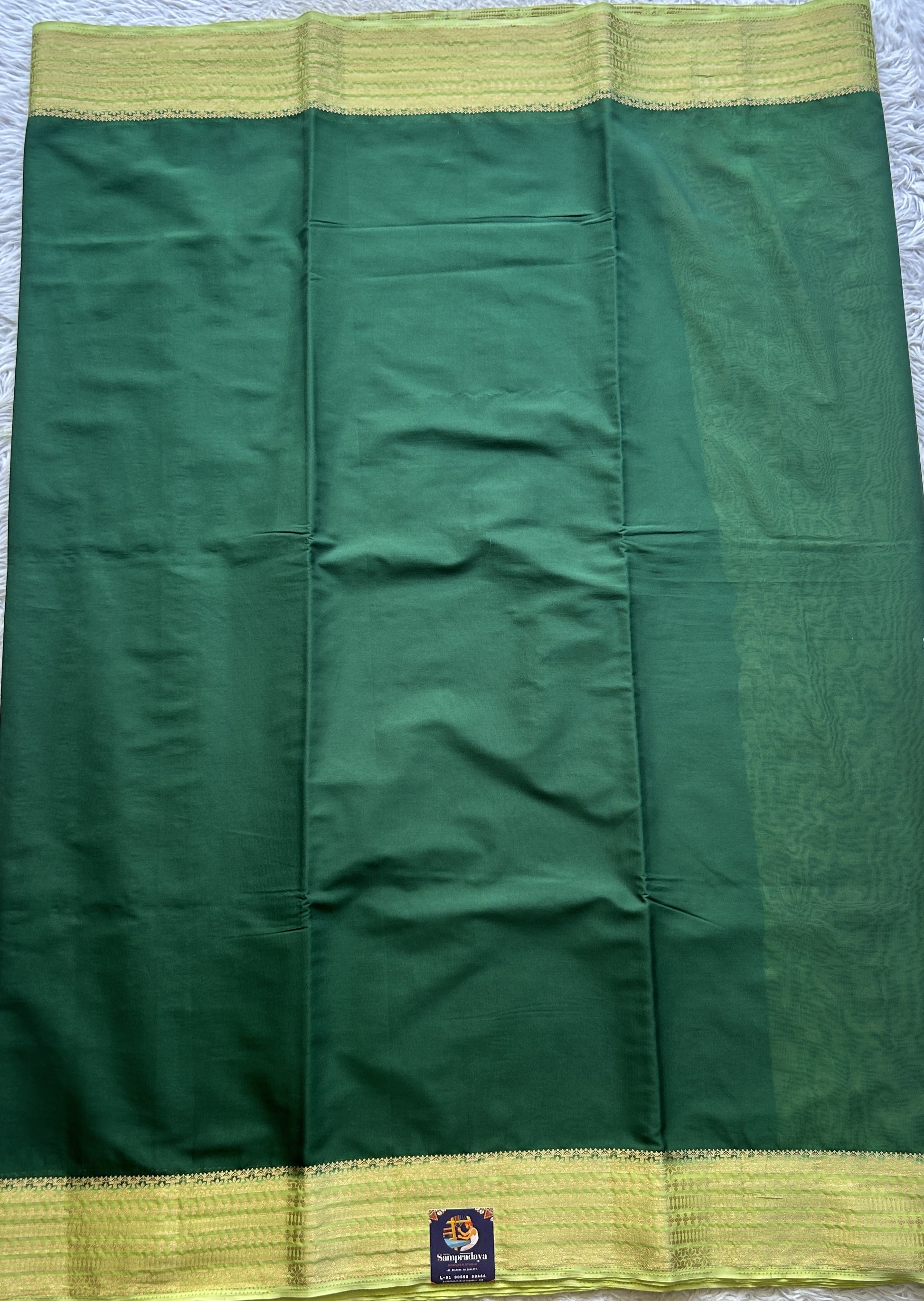 Semi Georgette Saree Dark Green Colored Complemented with a Lemon Green Color Zari Border. - Sampradaya Designer Studio