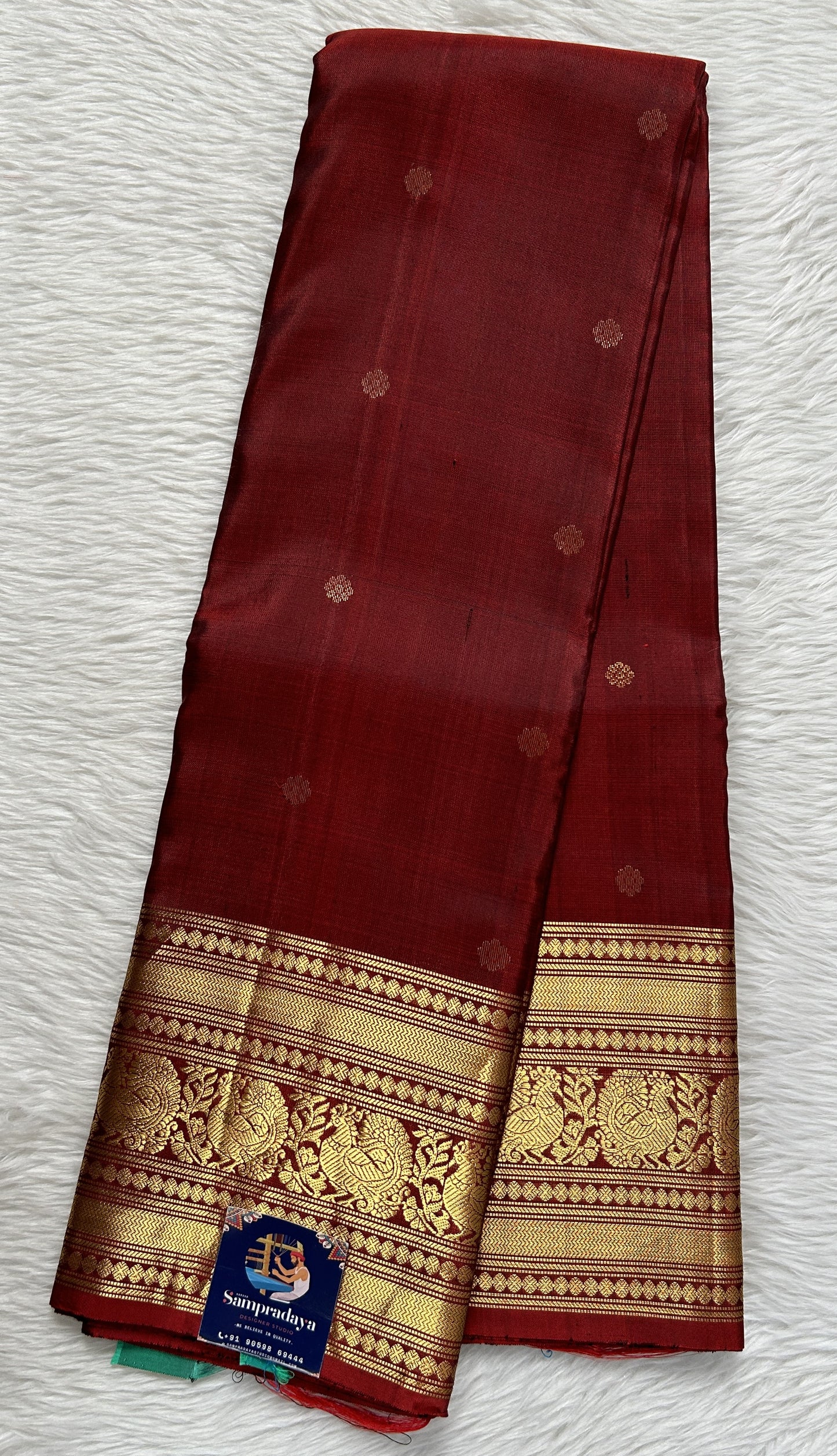 Kanjivaram Festive Silk Saree Maroon colored Saree complemented with a Gold Kanchi border. - Sampradaya Designer Studio