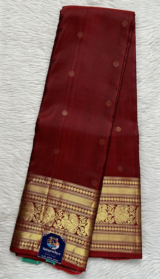 Kanjivaram Festive Silk Saree Maroon colored Saree complemented with a Gold Kanchi border. - Sampradaya Designer Studio