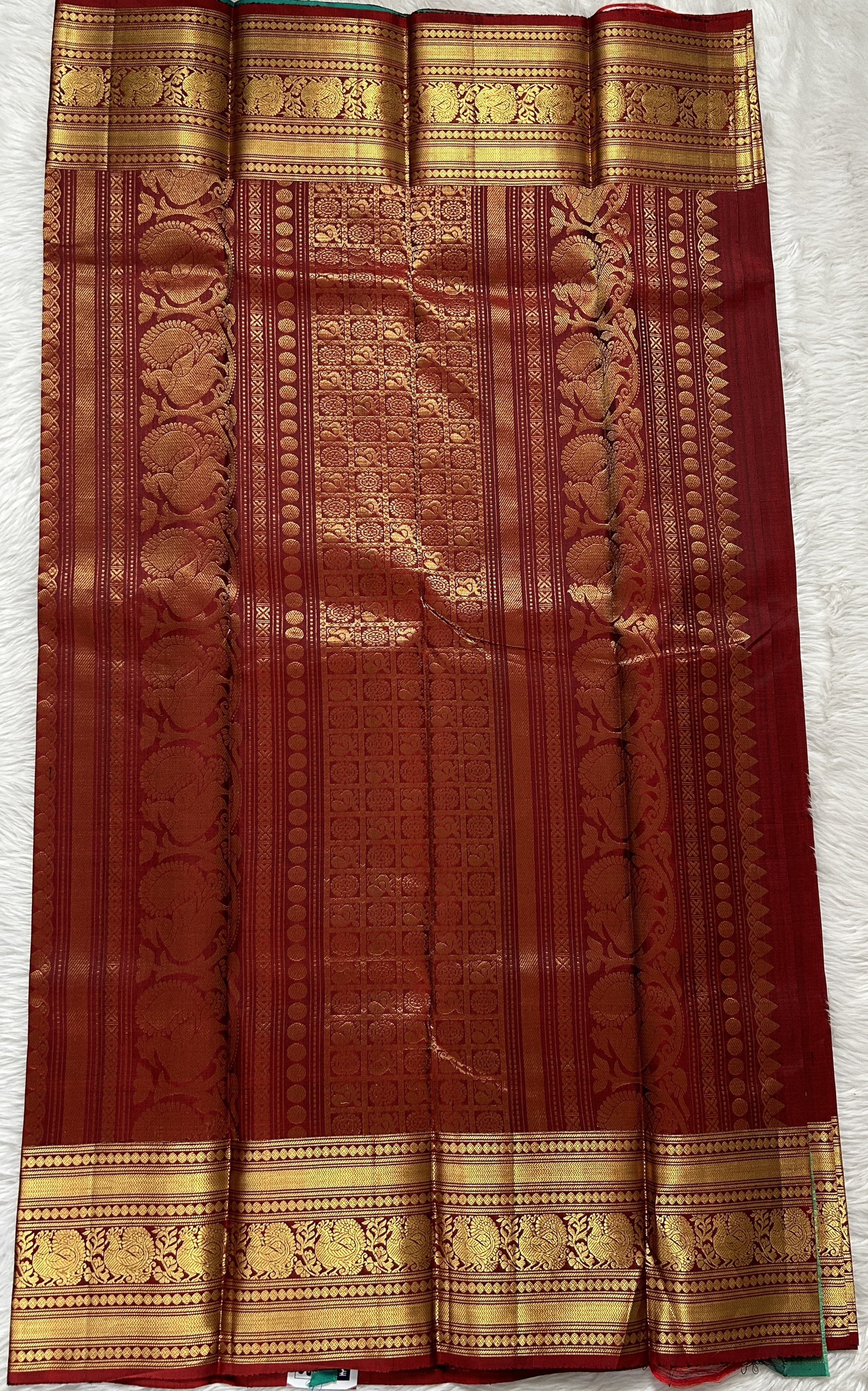 Kanjivaram Festive Silk Saree Maroon colored Saree complemented with a Gold Kanchi border. - Sampradaya Designer Studio