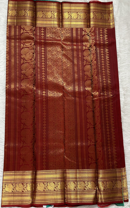 Kanjivaram Festive Silk Saree Maroon colored Saree complemented with a Gold Kanchi border. - Sampradaya Designer Studio