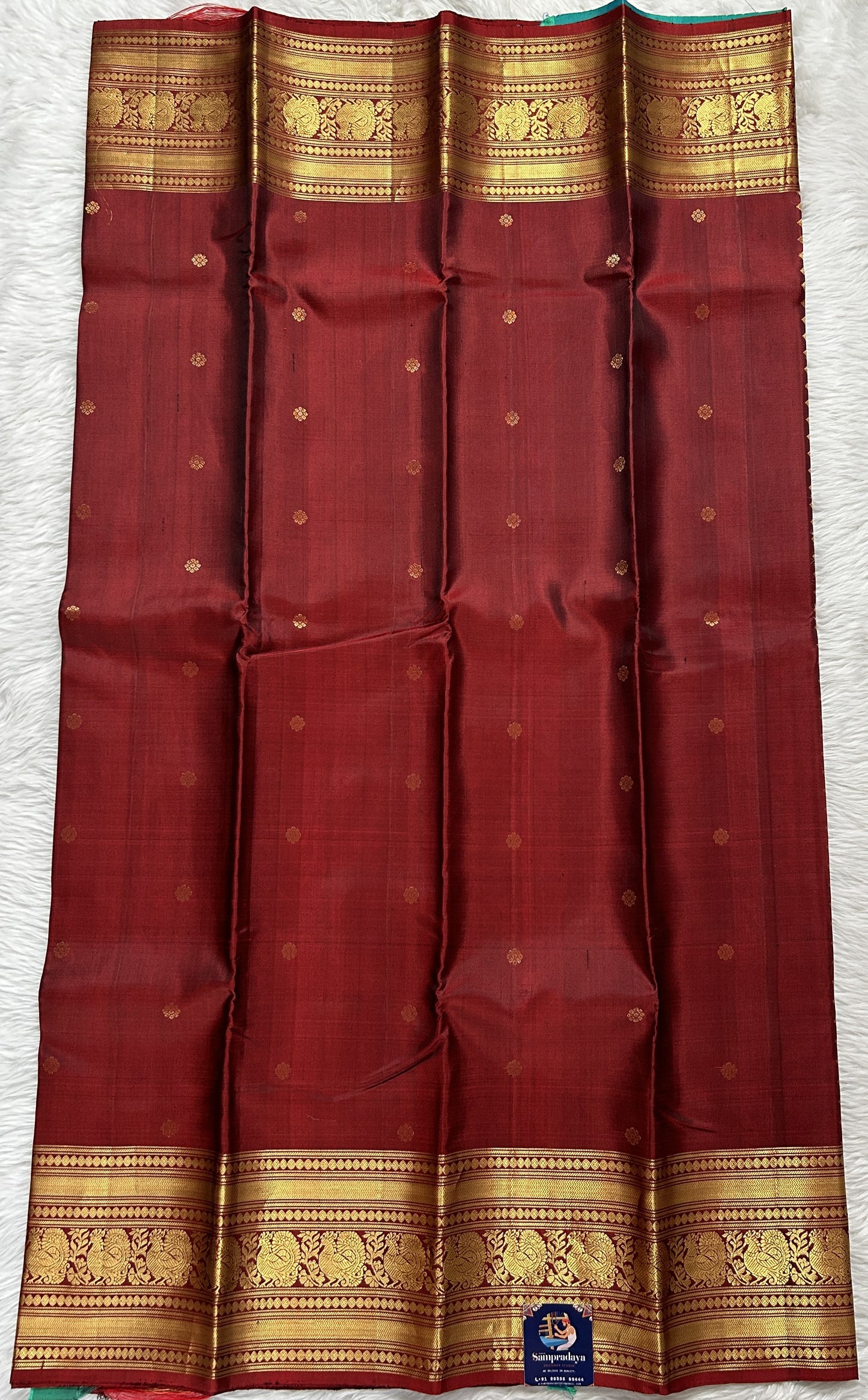 Kanjivaram Festive Silk Saree Maroon colored Saree complemented with a Gold Kanchi border. - Sampradaya Designer Studio