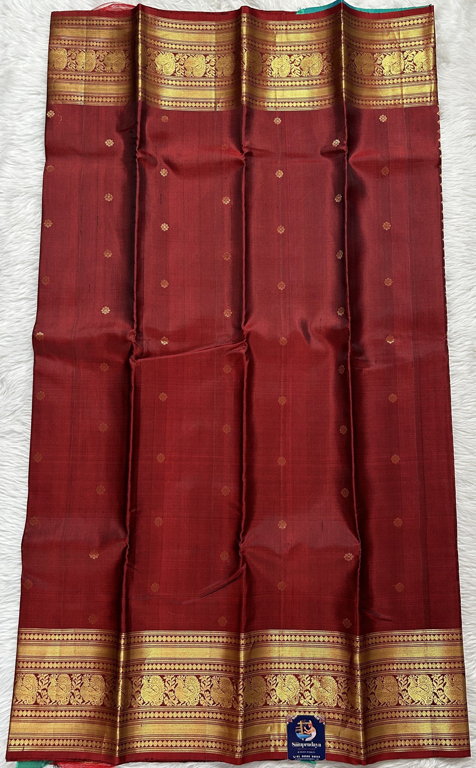 Kanjivaram Festive Silk Saree Maroon colored Saree complemented with a Gold Kanchi border. - Sampradaya Designer Studio