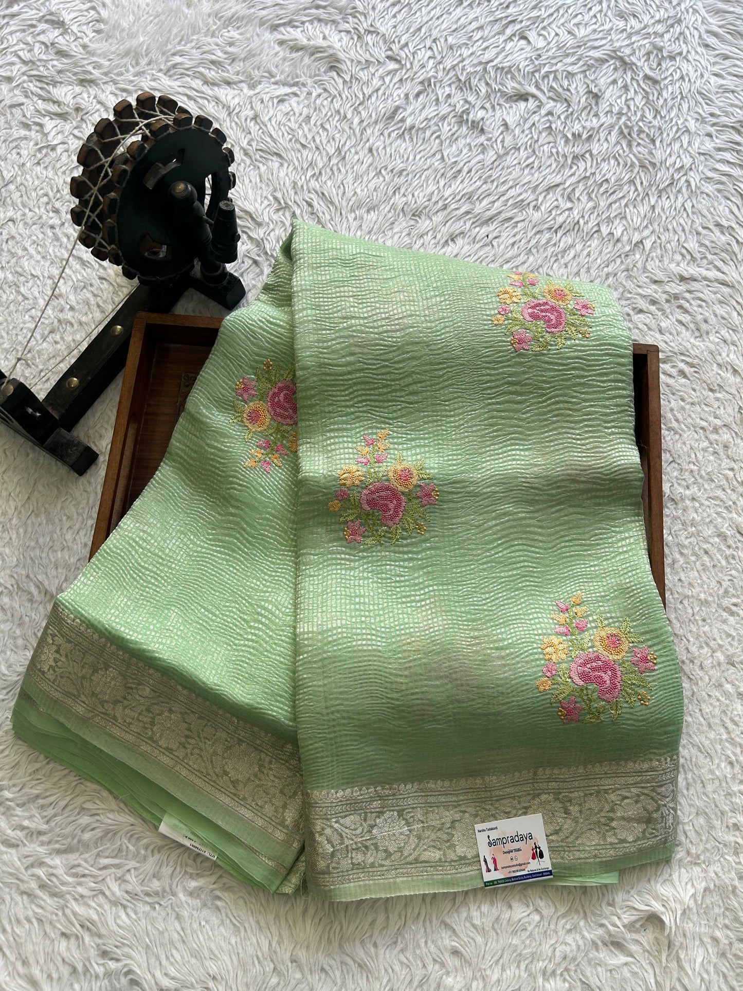 Banarasi Fancy Crushed Saree Pastel Green Colored Complemented with a Silver Zari Border.