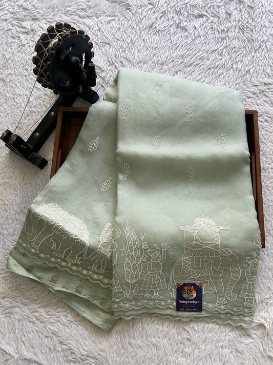 Banarasi Kora Saree Light Pista Green Colored Complemented with a  Machine Embroidery And Scallop Border.