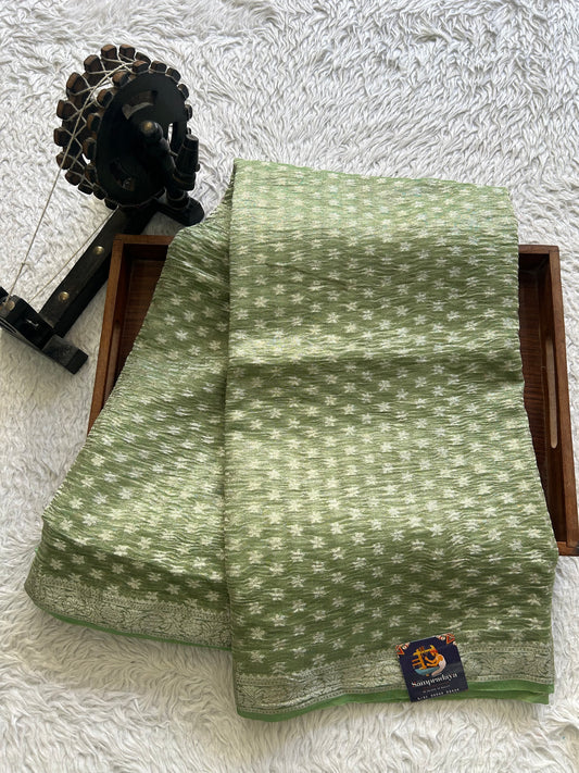 Banarasi Fancy Crushed Saree Light Green Colored Complemented with a Silver Zari Border.