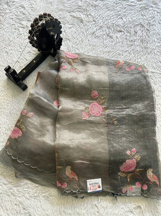 Banarasi Kora Saree Elephant Gray Colored Complemented with a  Machine Embroidery And Scallop Border.