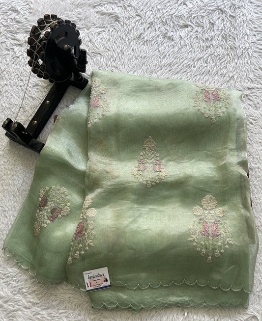 Banarasi Kora Saree Sea Foam Colored Complemented with a Scallop Border.