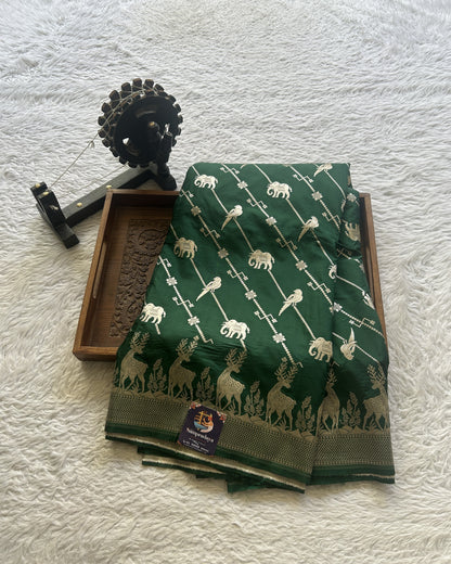 Semi Raw Silk Saree Bottle Green Colored Elegantly Paired with a Zari Border. - Sampradaya Designer Studio