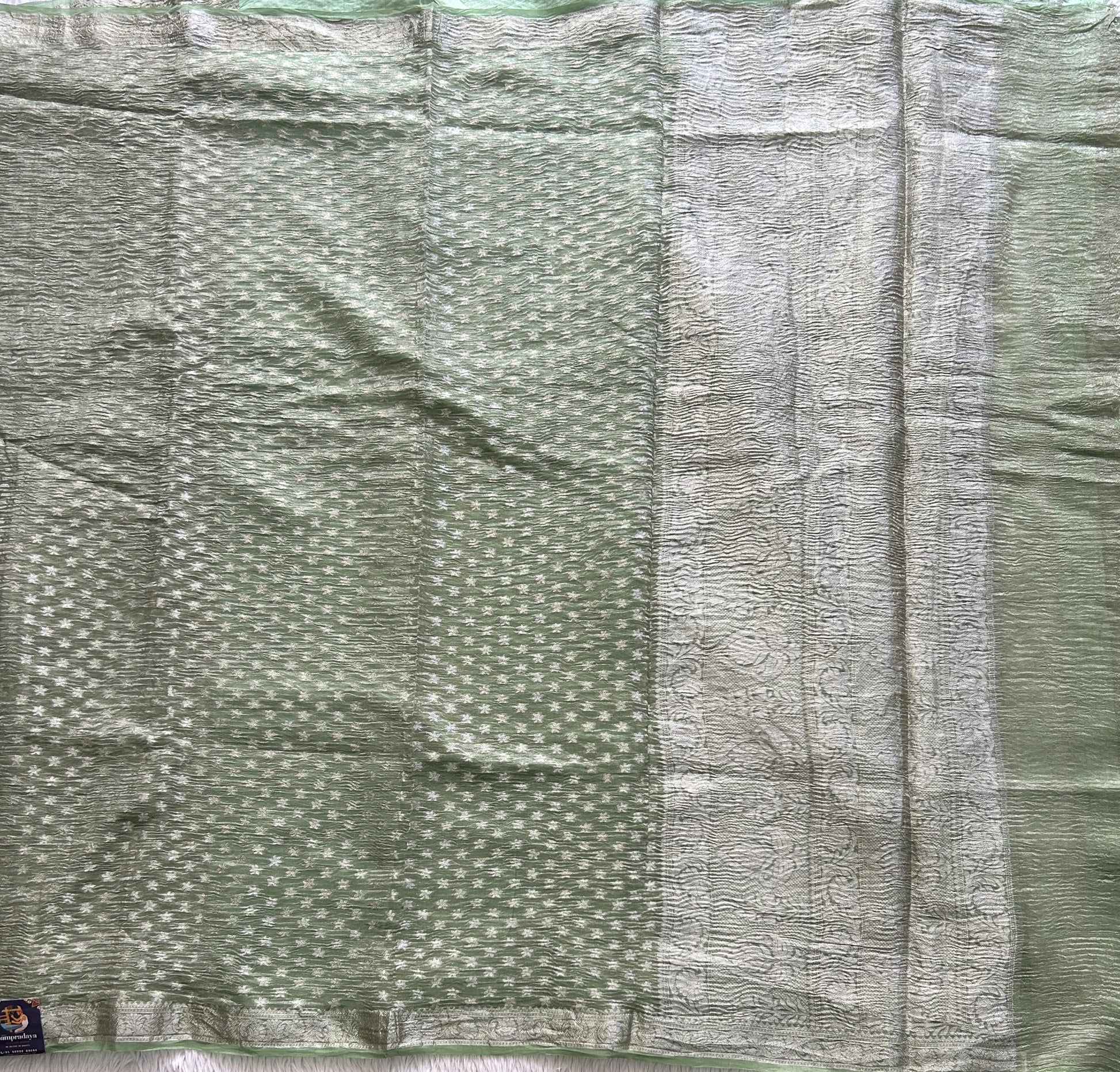 Banarasi Fancy Crushed Saree Light Green Colored Complemented with a Silver Zari Border. - Sampradaya Designer Studio