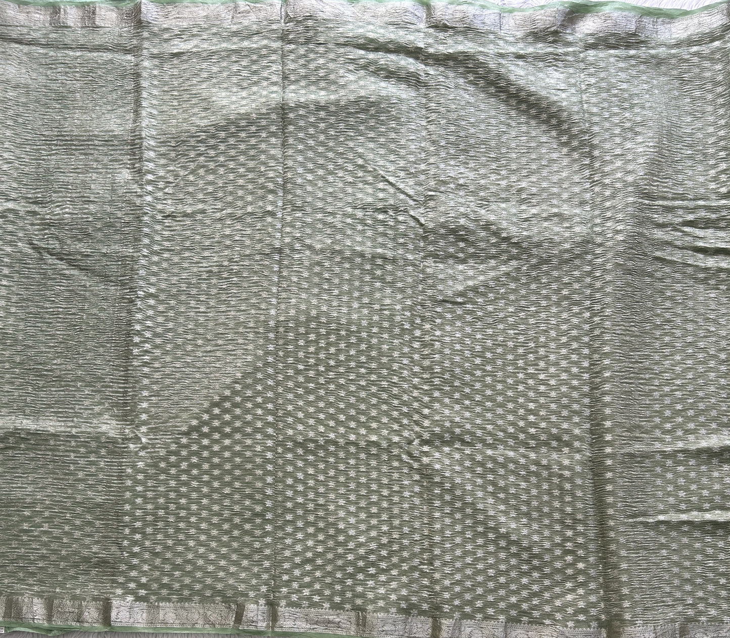 Banarasi Fancy Crushed Saree Light Green Colored Complemented with a Silver Zari Border. - Sampradaya Designer Studio