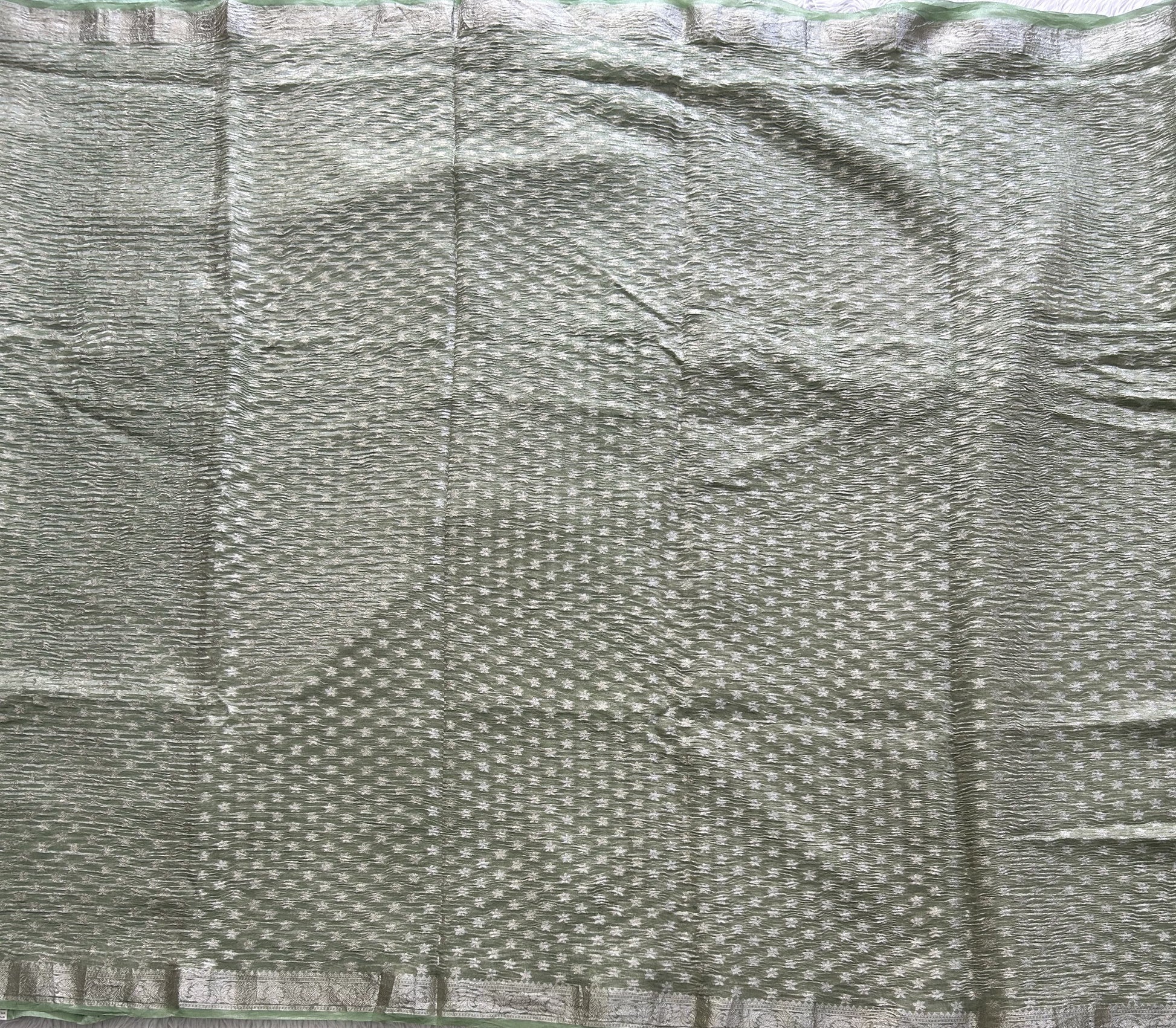 Banarasi Fancy Crushed Saree Light Green Colored Complemented with a Silver Zari Border. - Sampradaya Designer Studio