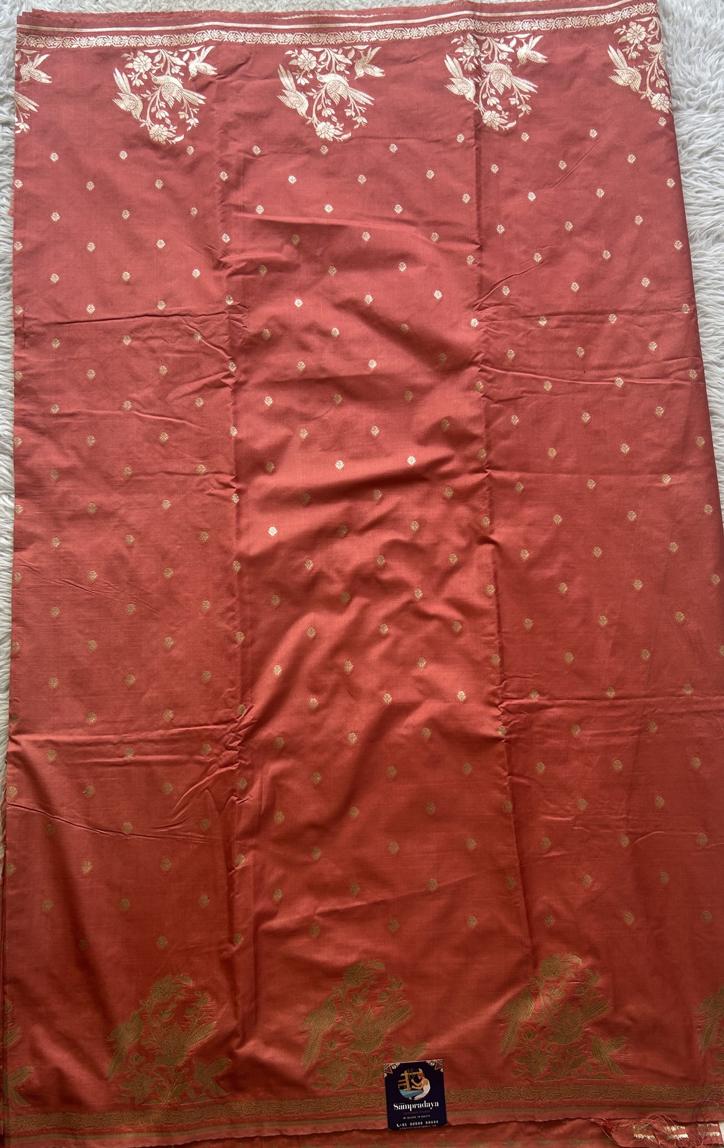 Semi Raw Silk Saree Peach Colored Elegantly Paired with a Buti Border. - Sampradaya Designer Studio