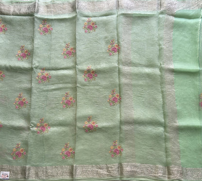 Banarasi Fancy Crushed Saree Pastel Green Colored Complemented with a Silver Zari Border.