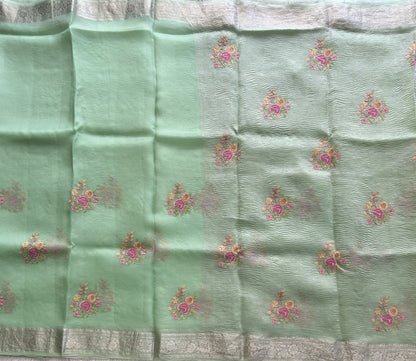 Banarasi Fancy Crushed Saree Pastel Green Colored Complemented with a Silver Zari Border.