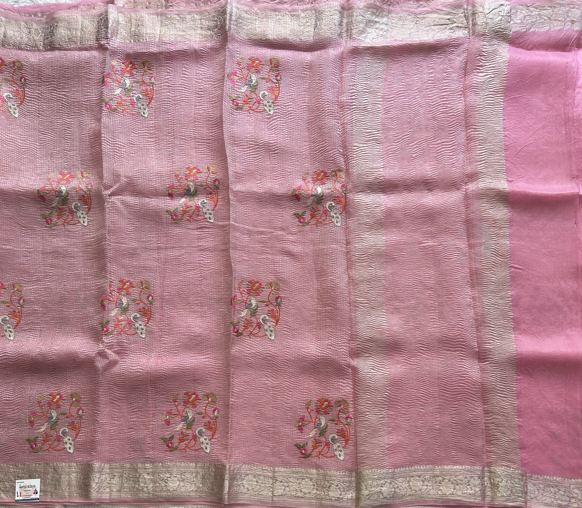 Banarasi Fancy Crushed Saree Baker Miller Pink Colored Complemented with a Silver Zari Border. - Sampradaya Designer Studio