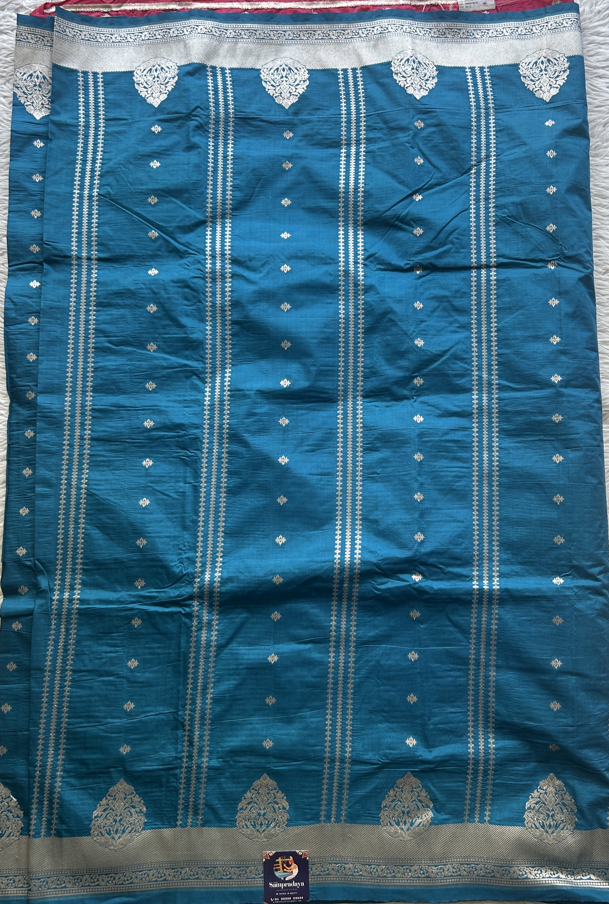 Semi Raw Silk Saree Teal Blue Colored Elegantly Paired with a Zari Border. - Sampradaya Designer Studio