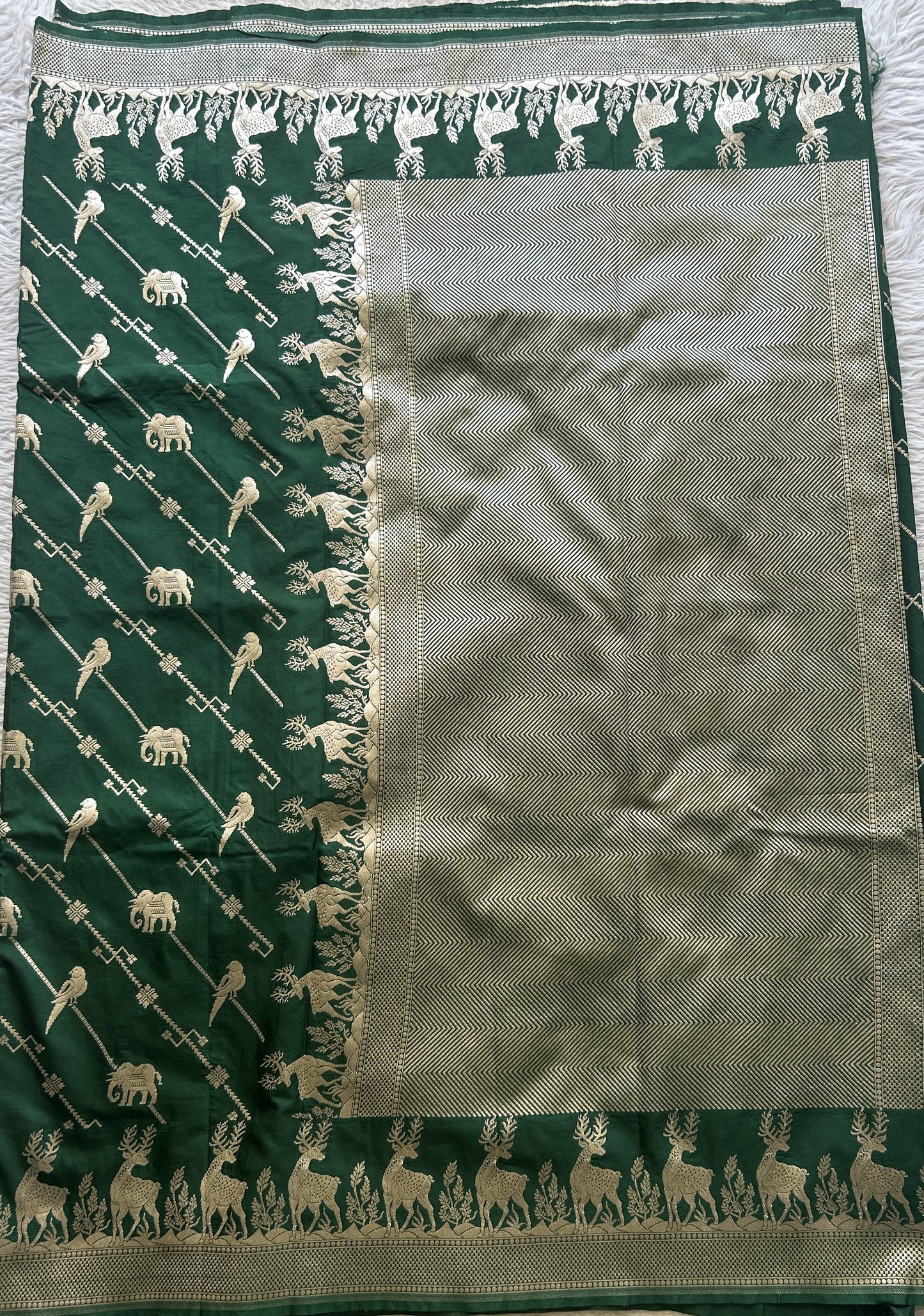 Semi Raw Silk Saree Bottle Green Colored Elegantly Paired with a Zari Border. - Sampradaya Designer Studio