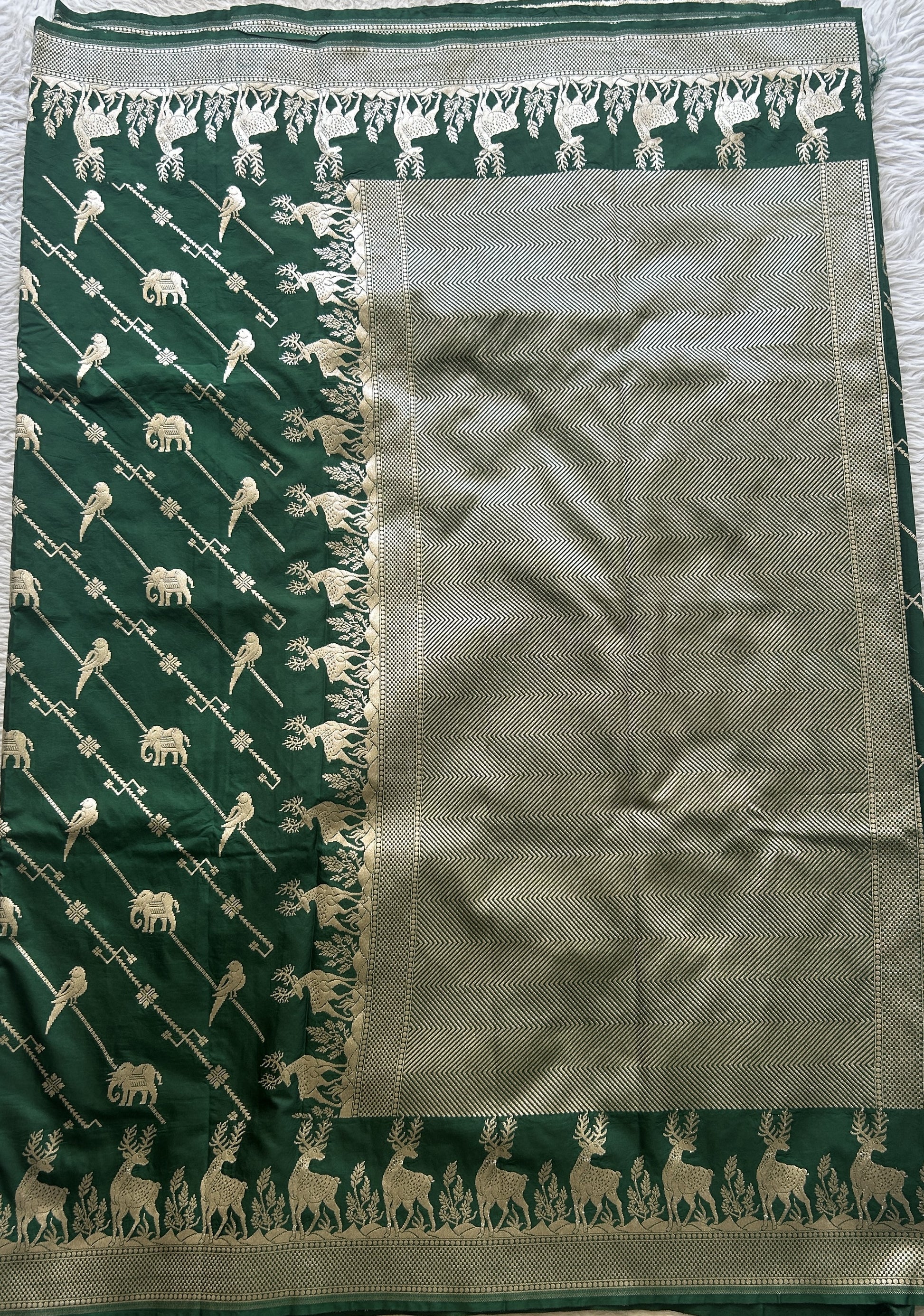 Semi Raw Silk Saree Bottle Green Colored Elegantly Paired with a Zari Border. - Sampradaya Designer Studio