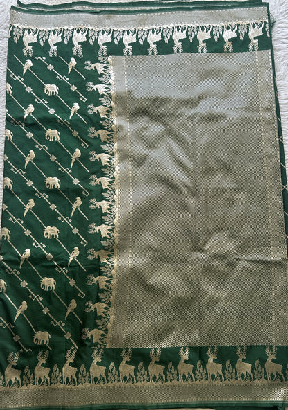 Semi Raw Silk Saree Bottle Green Colored Elegantly Paired with a Zari Border. - Sampradaya Designer Studio