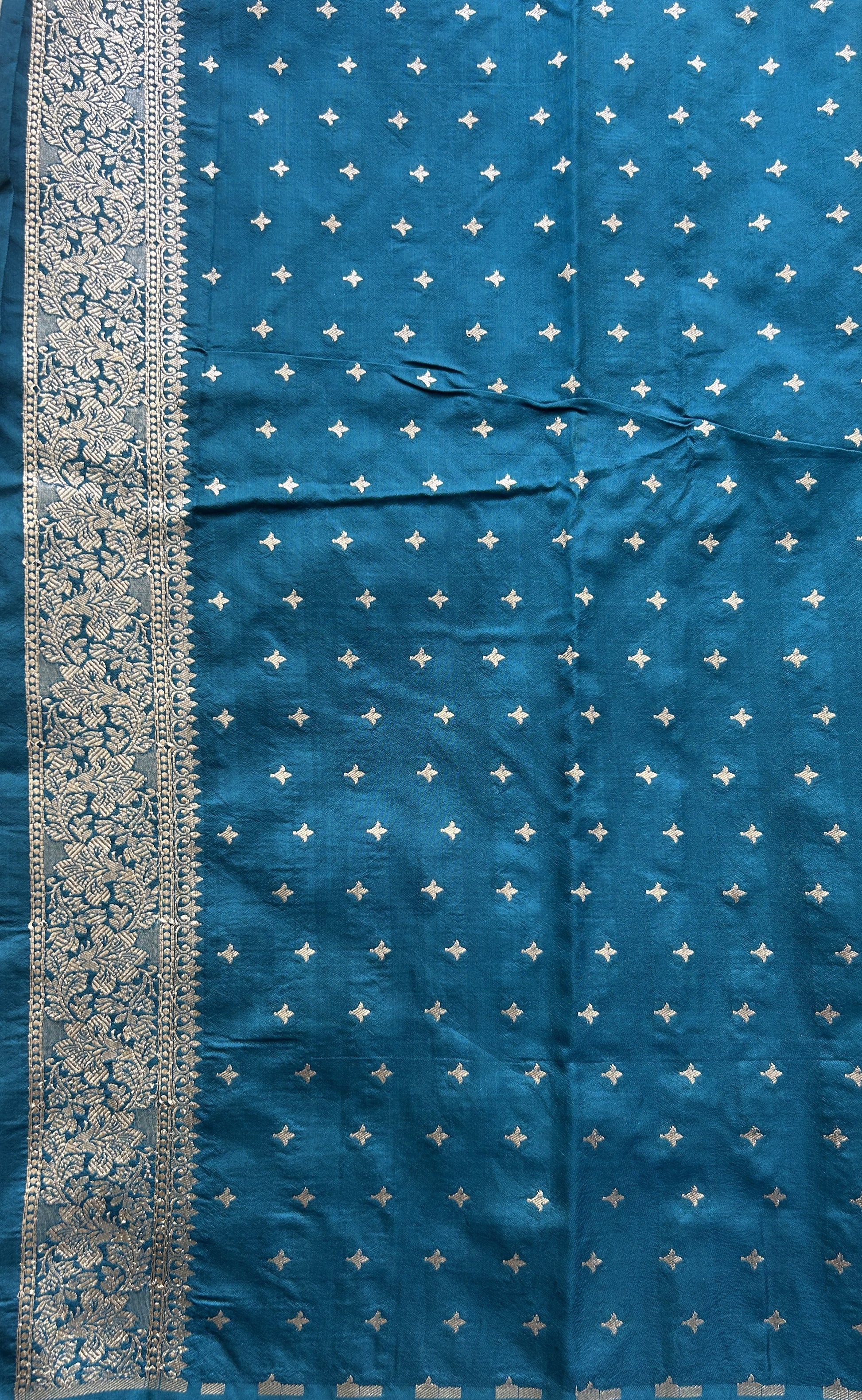 Semi Raw Silk Saree Peacock Blue Colored Elegantly Paired with a Buti Border. - Sampradaya Designer Studio