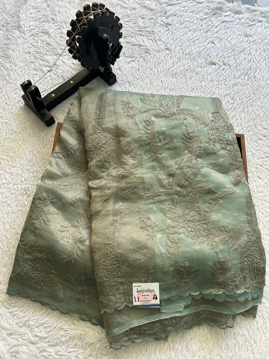 Banarasi Kora Saree Basil Green Colored Complemented with a Scallop Border.