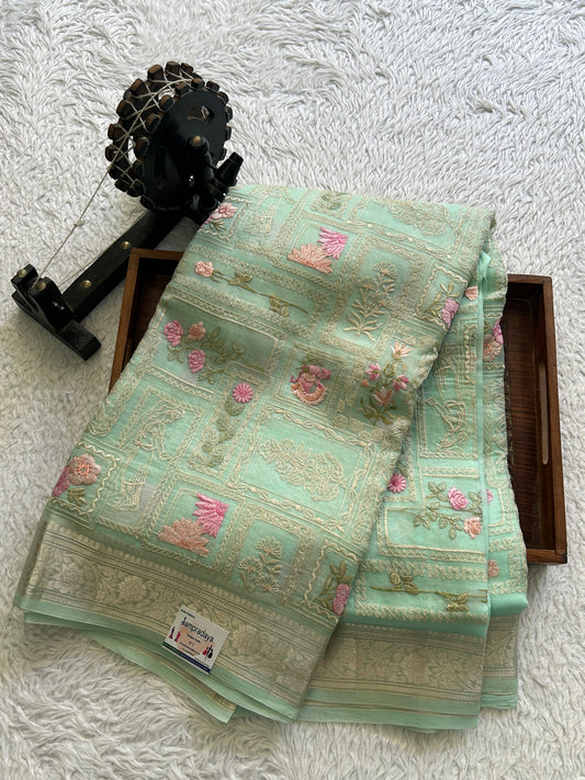 Banarasi Kora Saree Mint Green Colored Complemented with a Silver Zari Border.