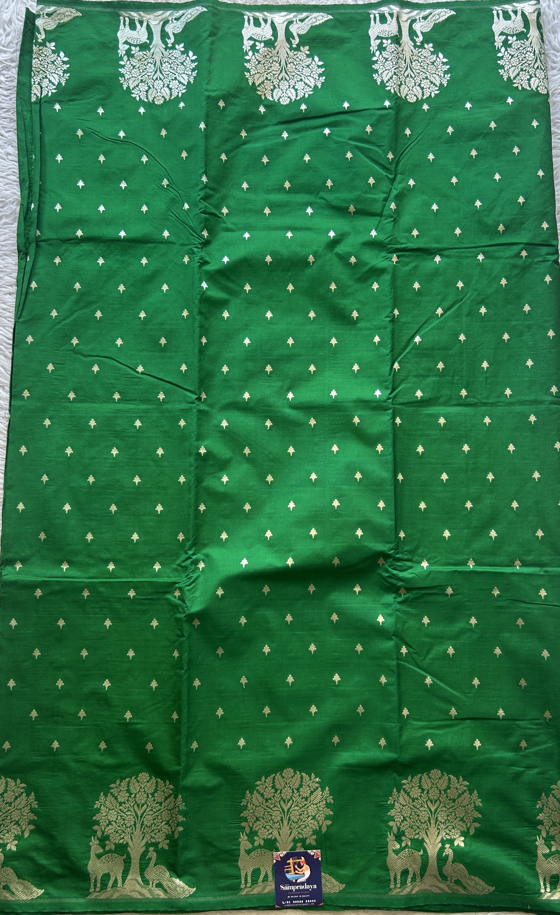 Semi Raw Silk Saree Green Colored Elegantly Paired with a Buti Border. - Sampradaya Designer Studio