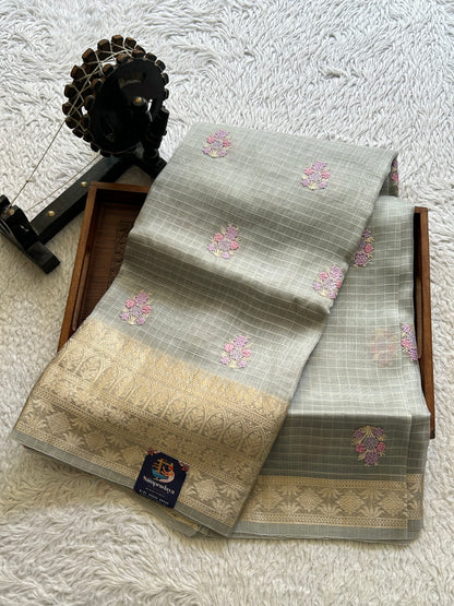 Banarasi Kora Saree Light Gray Colored Complemented with a Silver Zari Border.