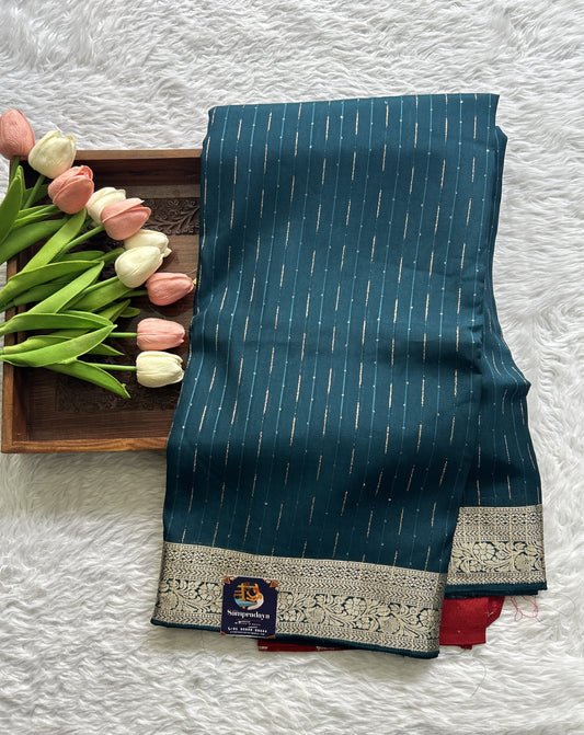 Semi Georgette Saree Peacock Blue Colored Complemented with a Zari Border. - Sampradaya Designer Studio