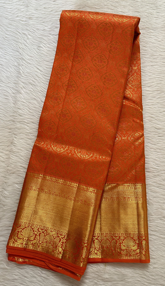 Kanjivaram Bridal Silk Saree Pastel Orange colored Saree complemented with a Gold Kanchi border. - Sampradaya Designer Studio