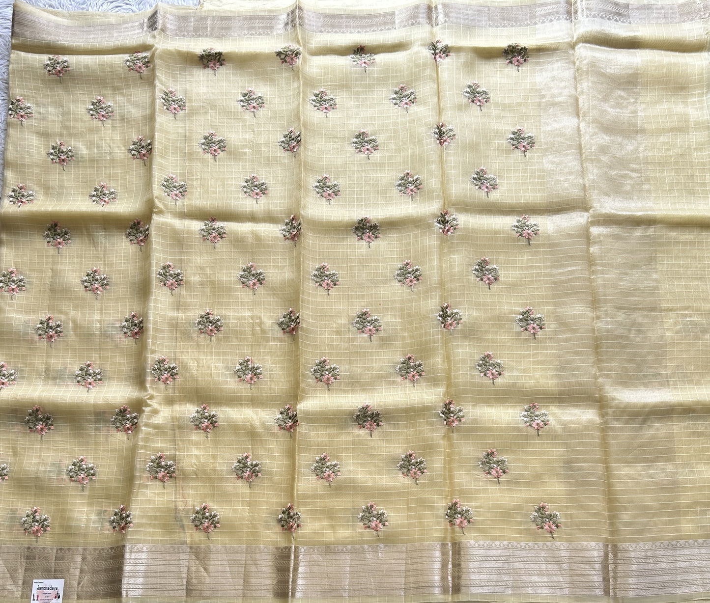 Banarasi Kora Saree Banana Yellow Colored Complemented with a Silver Zari Border.