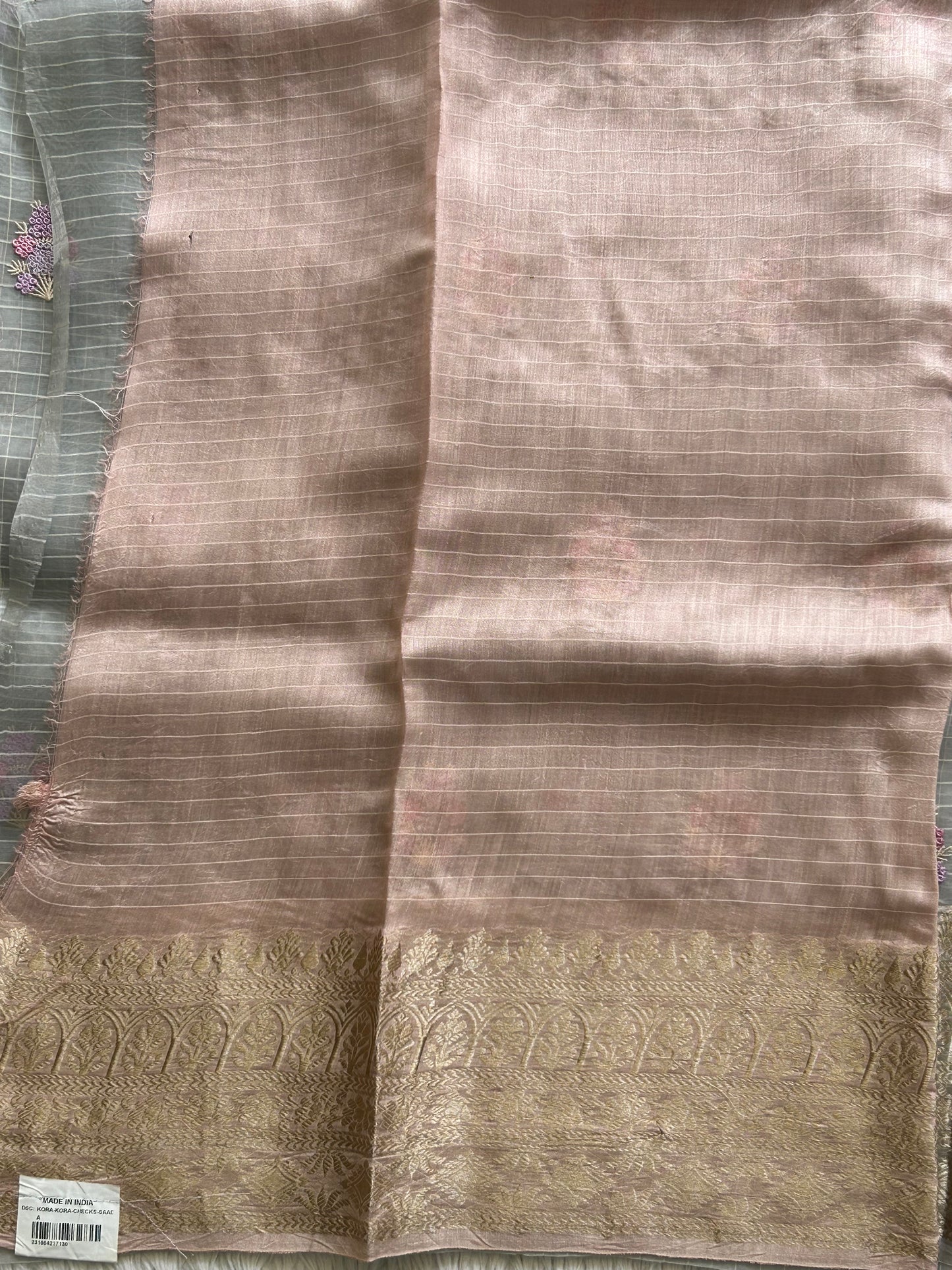 Banarasi Kora Saree Light Gray Colored Complemented with a Silver Zari Border.