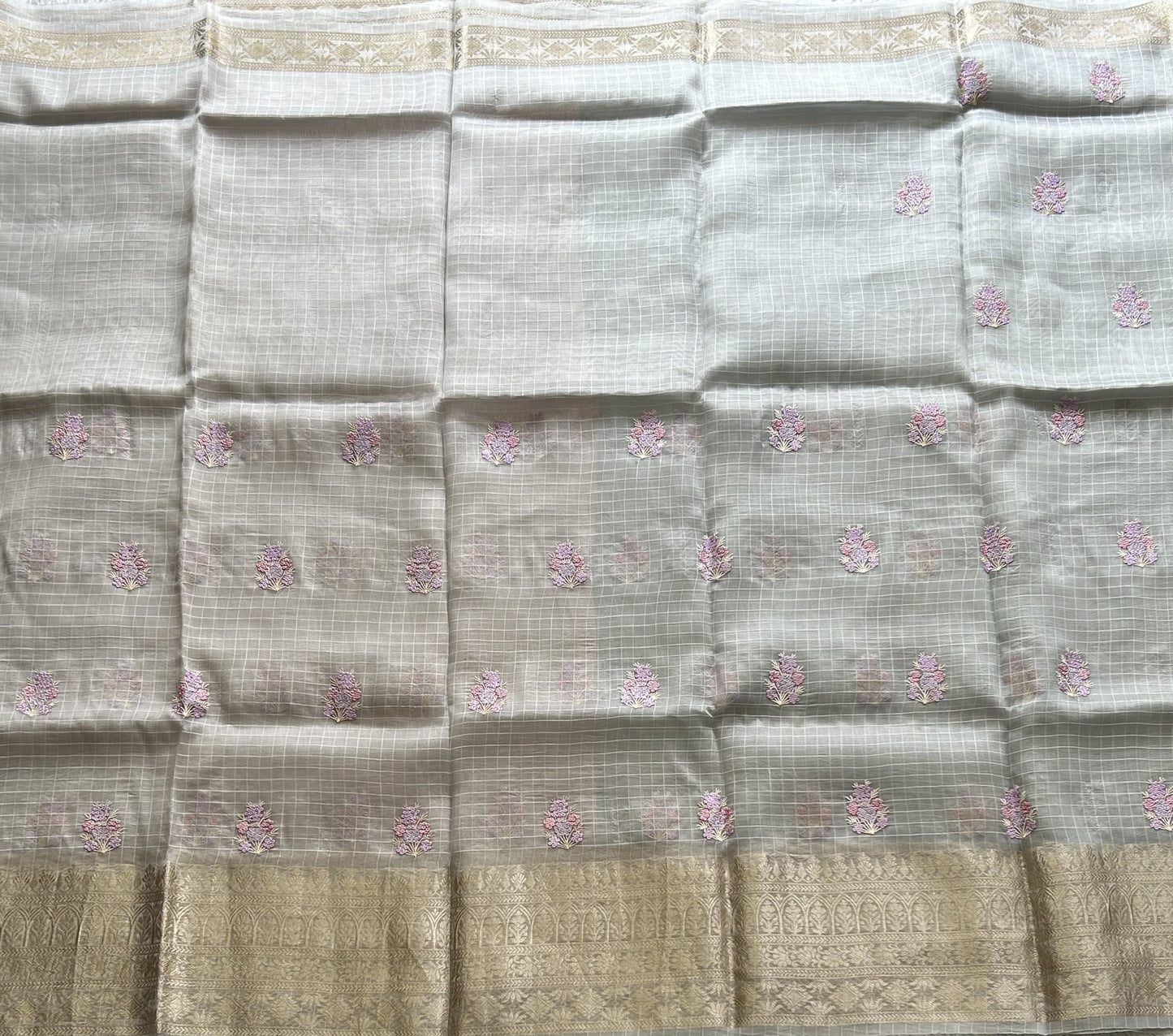 Banarasi Kora Saree Light Gray Colored Complemented with a Silver Zari Border.