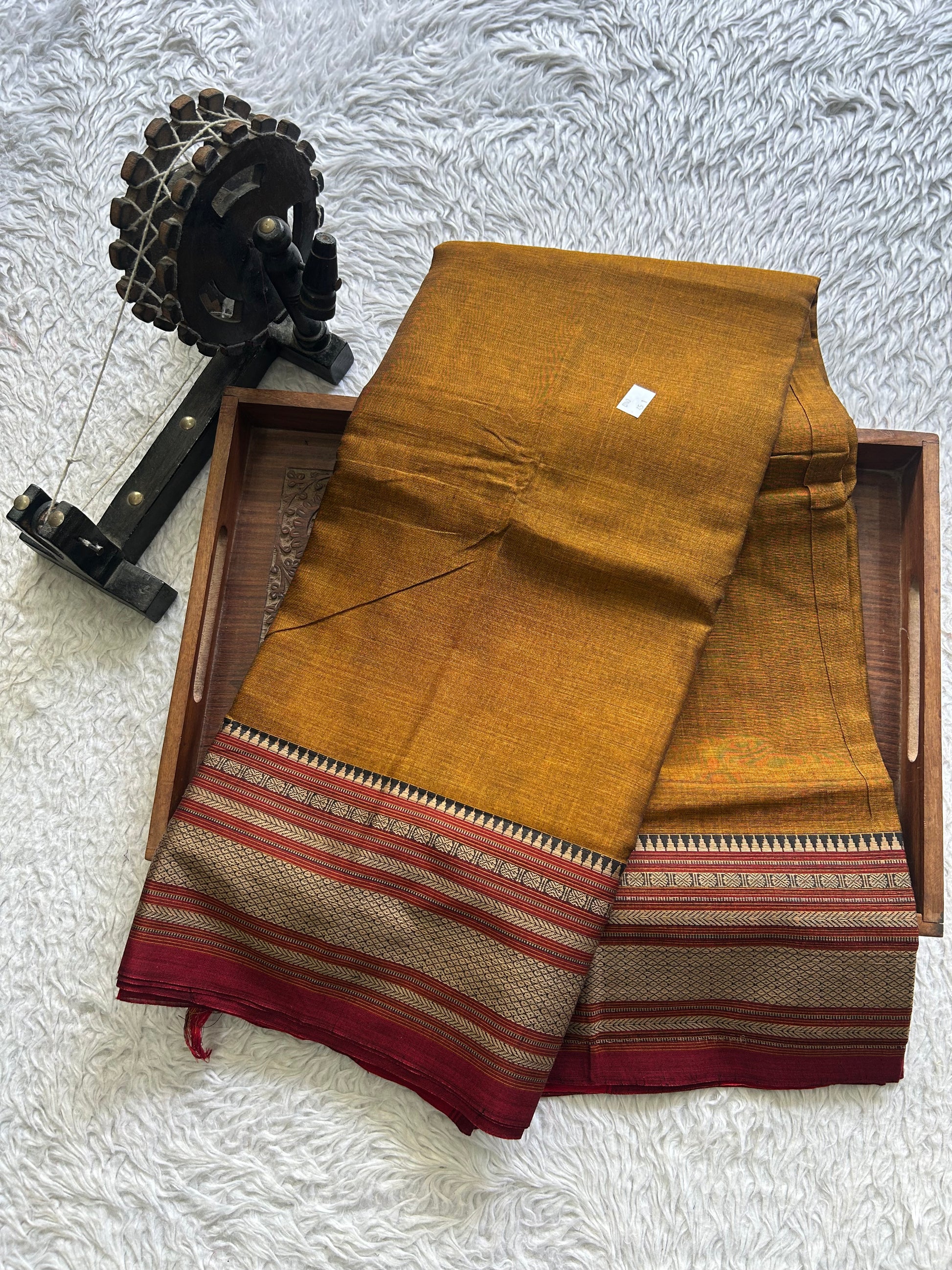 Narayanpet Cotton Saree Burnt Colored Complemented with a Thread Border. - Sampradaya Designer Studio