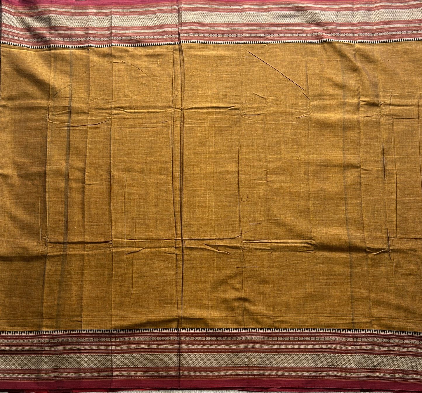 Narayanpet Cotton Saree Burnt Colored Complemented with a Thread Border. - Sampradaya Designer Studio