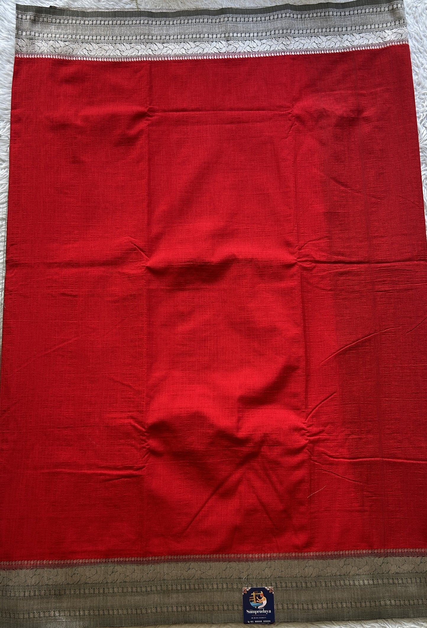 Semi Georgette Plain Saree Red Colored Complemented with a Zari Border. - Sampradaya Designer Studio