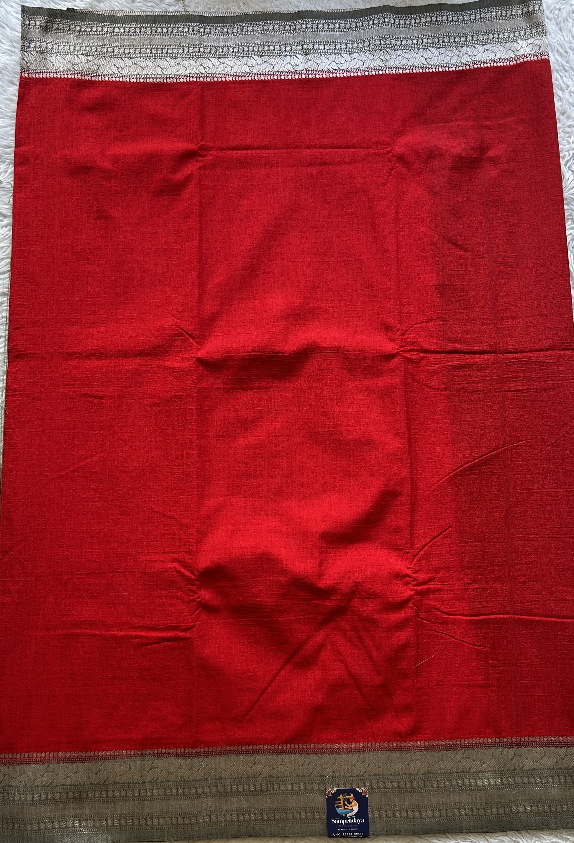 Semi Georgette Plain Saree Red Colored Complemented with a Zari Border. - Sampradaya Designer Studio