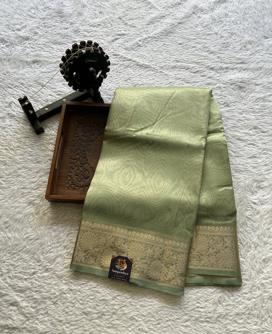 Tissue Organza Saree Light Green Colored Complemented with a Zari Border. - Sampradaya Designer Studio